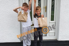 Junior members with their lunch and activity pack deliveries